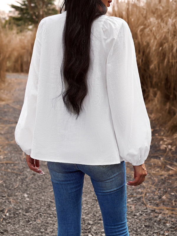 नई महिलाओं का स्वभाव ठोस रंग वी-गर्दन लंबी आस्तीन वाला टॉप है